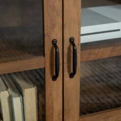 Sophie Rustic Farmhouse X Frame Glass Doors TV Stand For TVs Up To 80" Rustic Oak - Saracina Home 9 Sophie Rustic Farmhouse X Frame Glass Doors TV Stand For TVs Up To 80" Rustic Oak - Saracina Home -Saracina Home Shop GUEST 2ef0568d 6fd0 4ebb b1a4 c946a519e5b9